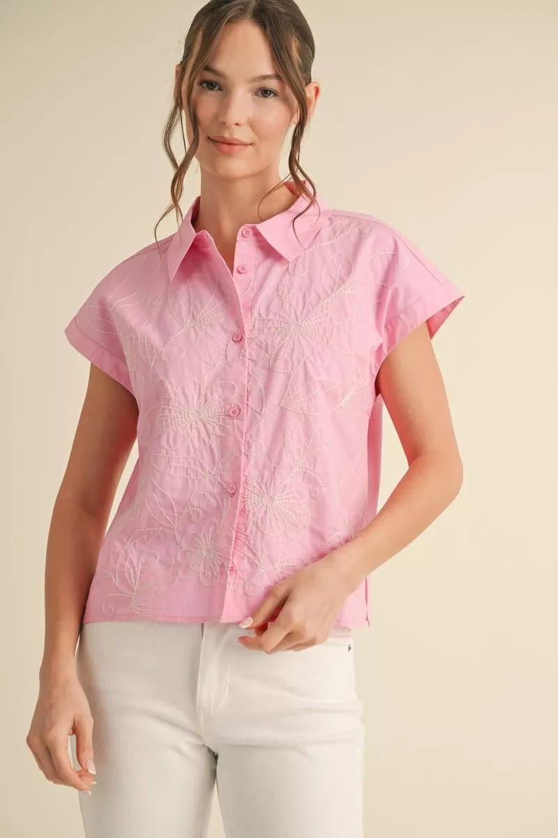 Flower embroidered top with collard neck, front buttoned closure, and short kimono sleeves.