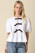 White Peplum Top with Black Bow Detail