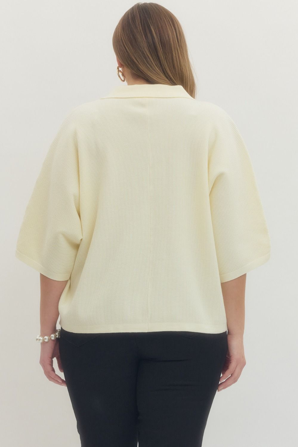 Cream Solid 3/4 sleeve knit top featuring open V-neck collar