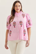 Pink solid short puff sleeve top featuring embroidered floral motif