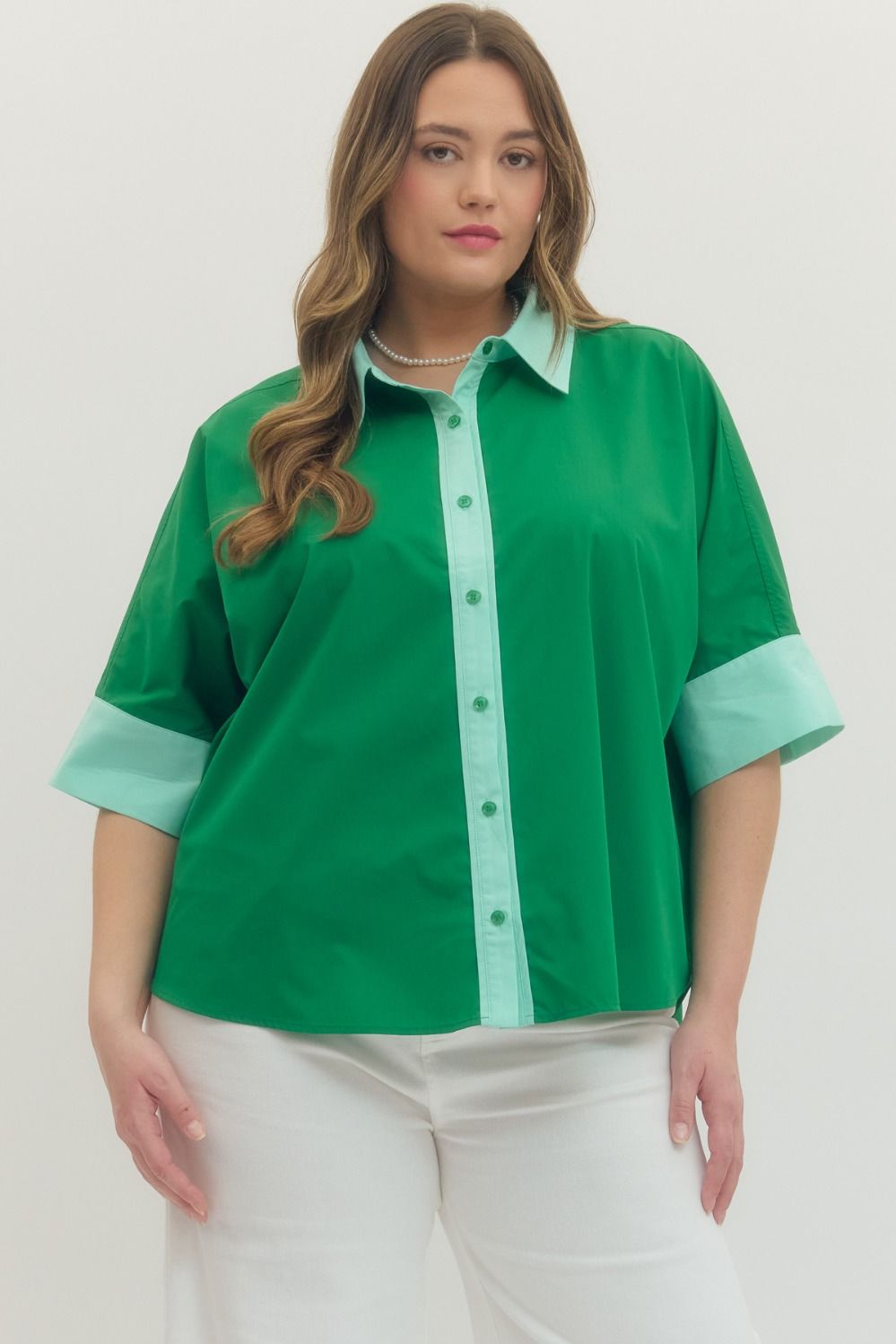 Green Solid short sleeve top featuring pointed collar