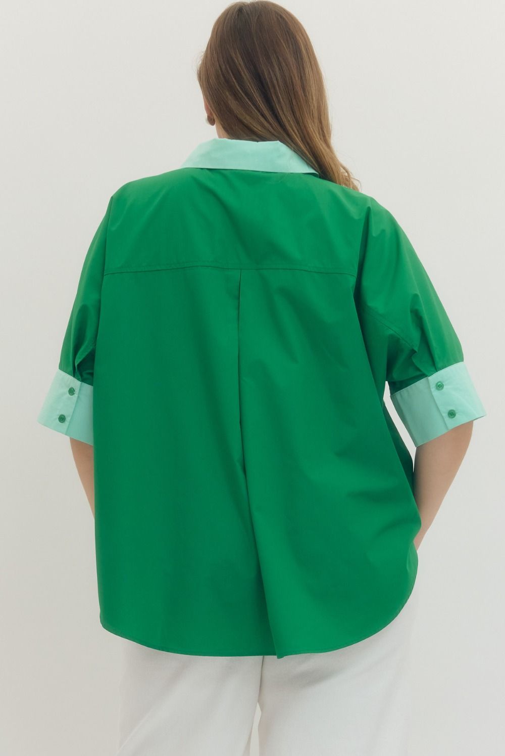 Green Solid short sleeve top featuring pointed collar